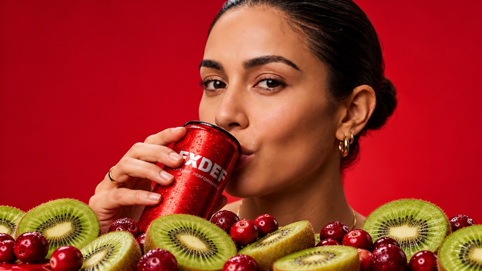 ExDef Rogue — woman drinking red can with kiwi and cranberries